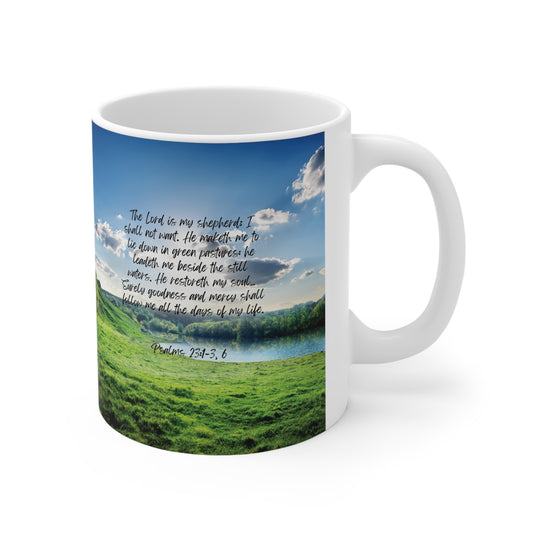 Psalm 23:1-3, 6: The Lord is my shepherd; I shall not want. He maketh me to lie down in green pastures: he leadeth me beside the still waters. He restoreth my soul… Surely goodness and mercy shall follow me all the days of my life. White mug.